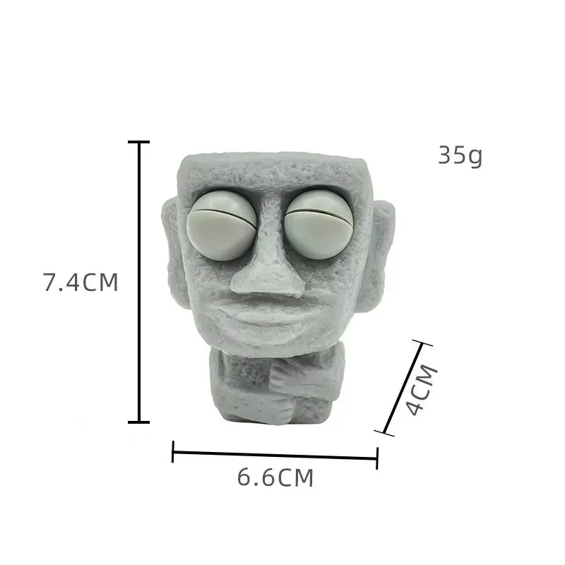 Stone man releases stress toy slowly rebounds soft Moai statue squeeze eyes interested expression relaxes stress children's gift