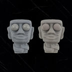 Stone man releases stress toy slowly rebounds soft Moai statue squeeze eyes interested expression relaxes stress children's gift