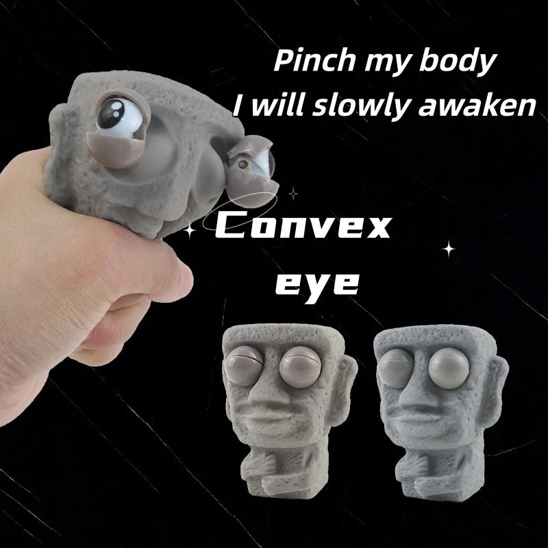 Stone man releases stress toy slowly rebounds soft Moai statue squeeze eyes interested expression relaxes stress children's gift